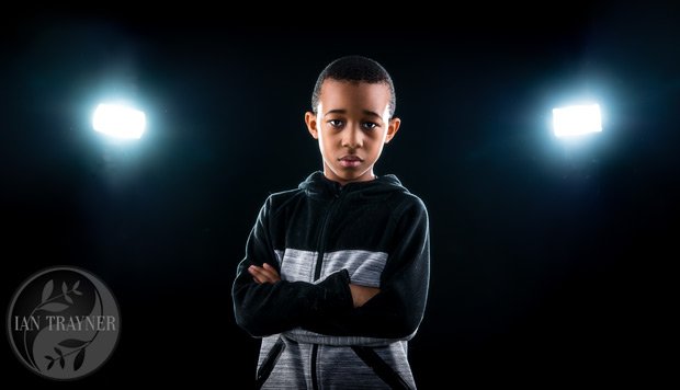 photo of boy in tracksuit with cool backlighting