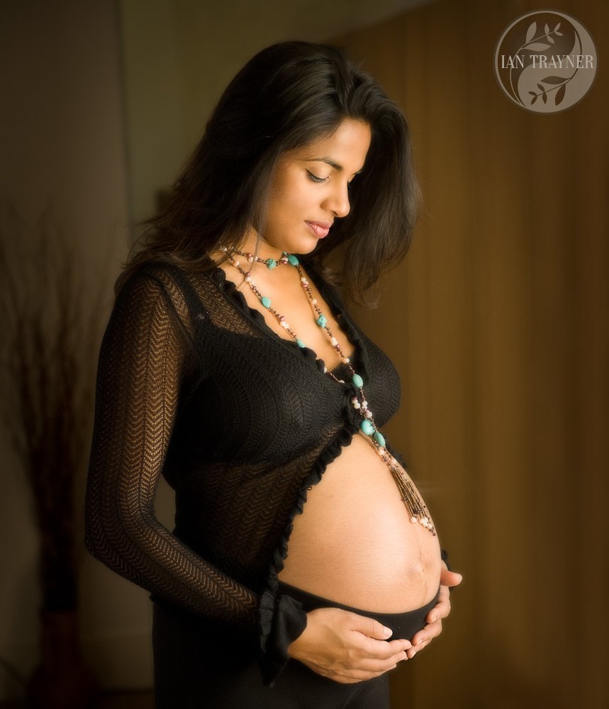 Maternity photography. Lovely soft image of very beautiful asian lady with her "bump"