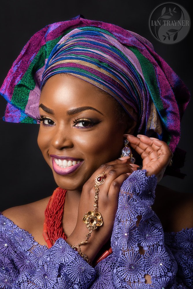 Headshot from a model experience photo shoot. Beautiful black lady looking very happy.