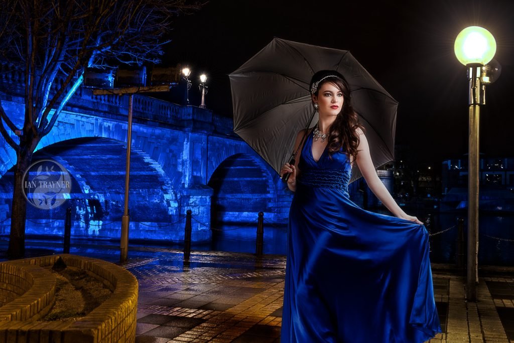 Portrait of Beauty Queen Rosemay Lloyd by Kingston Bridge at nightime. Kingston upon Thames.